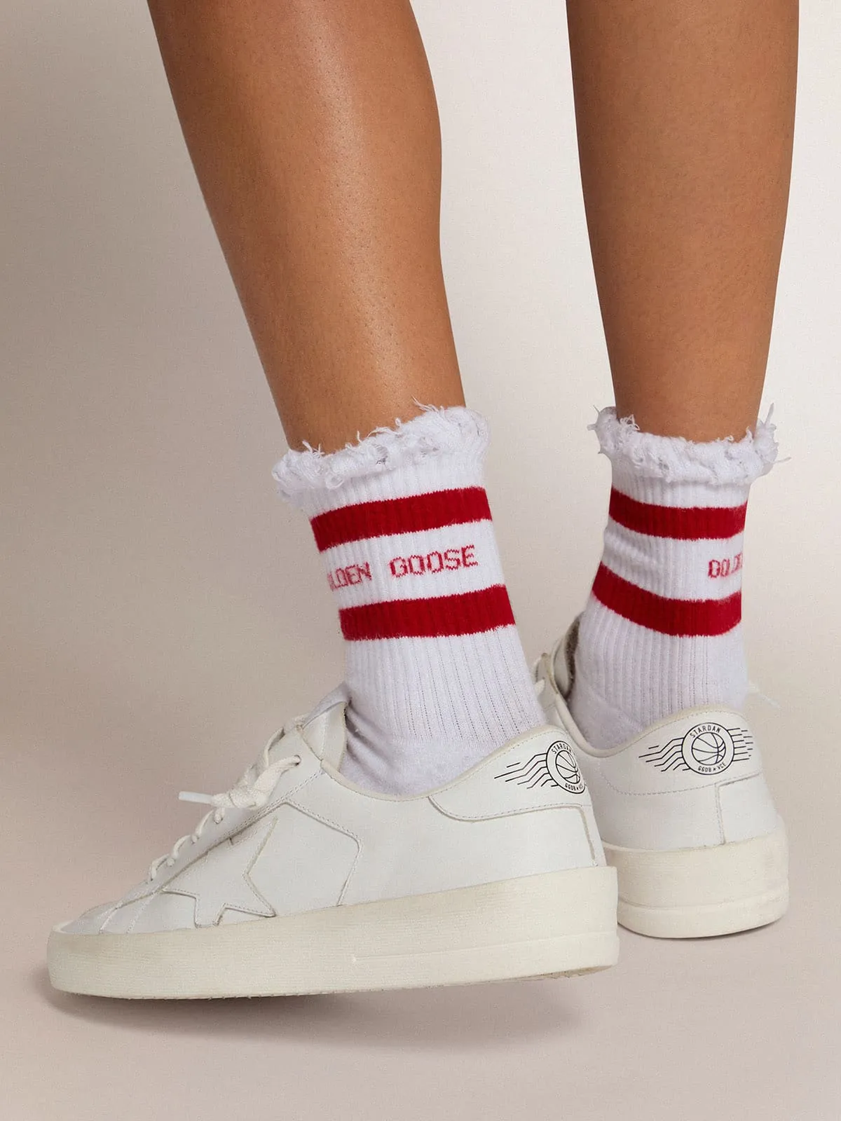 Cotton socks with distressed finishes, red stripes and logo